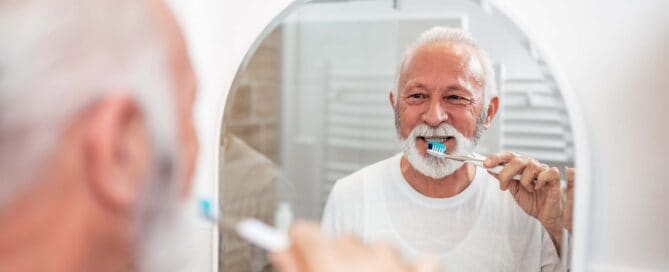 Senior man brushing his teeth